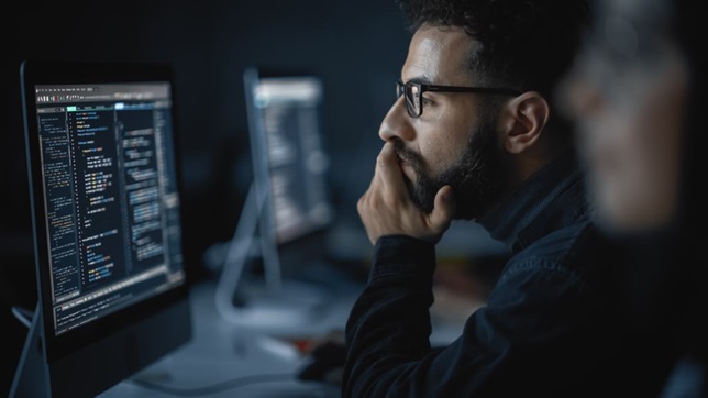 man staring at code